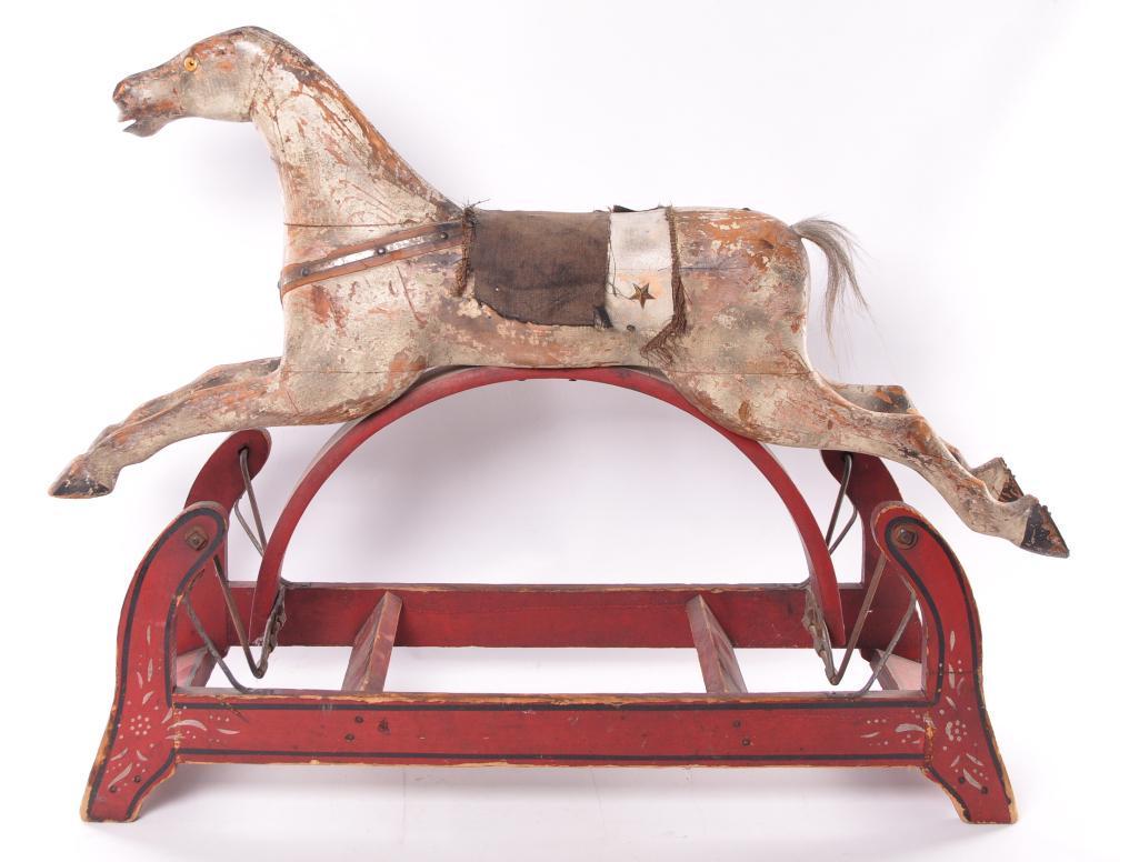 Antique Primitive Wooden Rocking Horse: 39 x 13 x 30 inches. Due to the size of this lot, third party shipping is recommended
