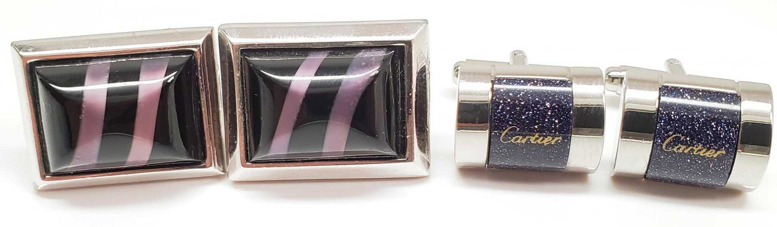 Lot of 2 Pairs : "Cartier" and Banded Purple Inlay: The Cartier silver and midnight crystal toggle back cufflinks measure 1/2 x 5/8 and are branded on center; the banded purple inlay pair measure 5/8 x 7/8