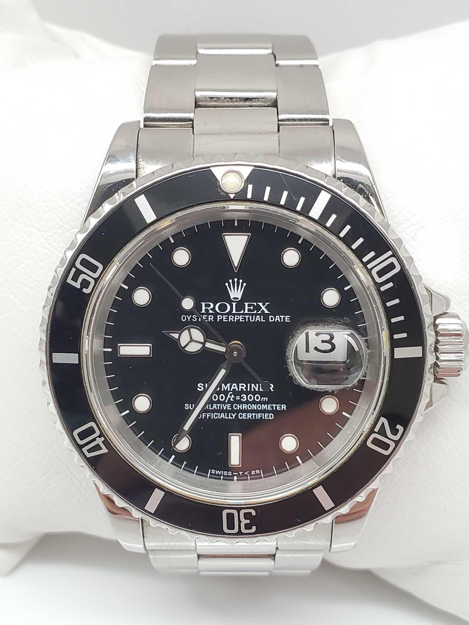 Vintage 1990's Rolex Submariner: This vintage Rolex Submariner Oyster Automatic wristwatch x886633, model 16610 has a black dial; ceramic, uni-directional rotating bezel; a brushed with polished stainless steel case and oyster band w