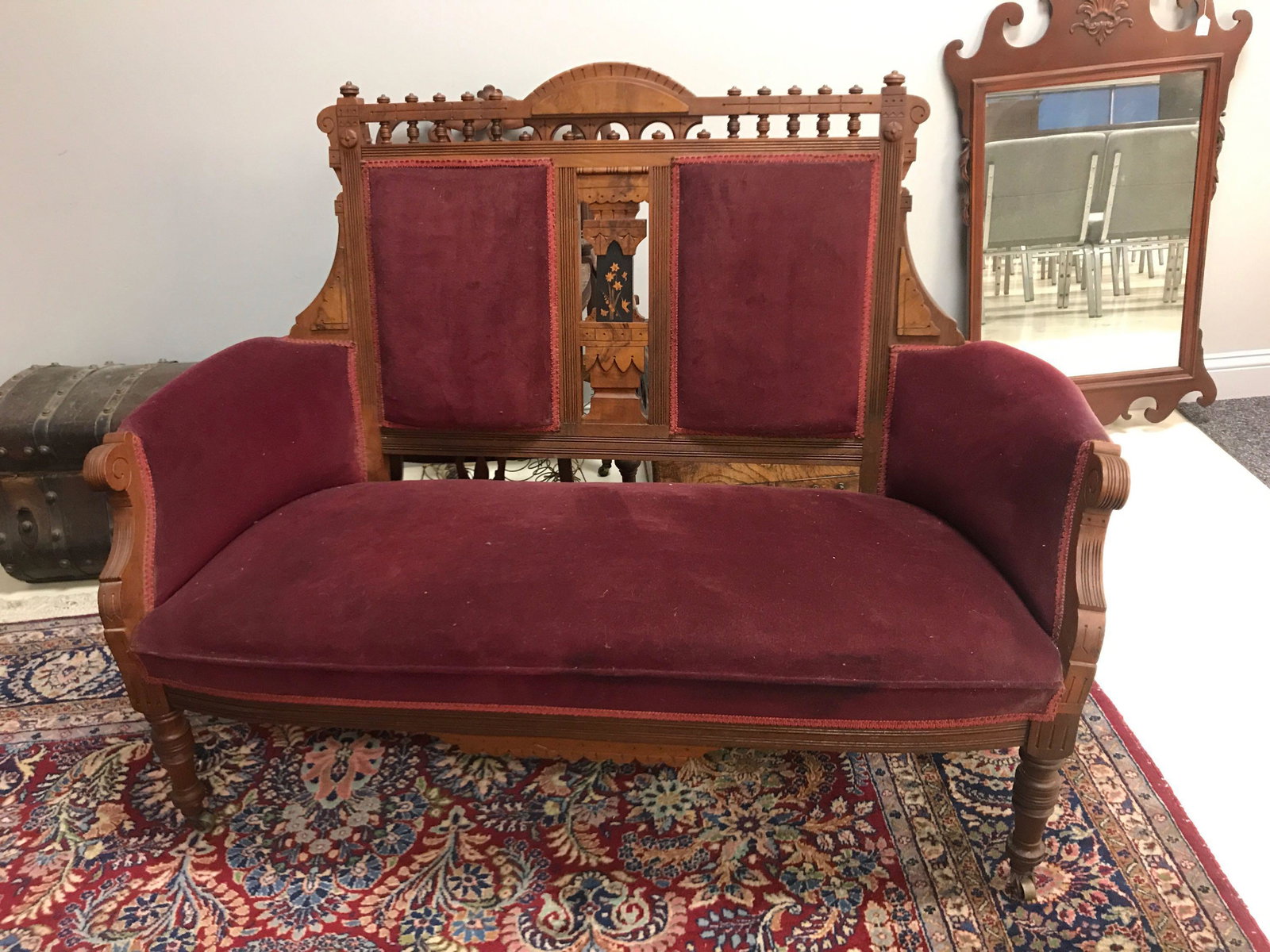 Antique Wood and Burgundy Settee: Some wear, missing one wheel.ÊÊ55x42x22ÊÊShipping is not available for this lot, pick-up only at our Gallery in Ottawa