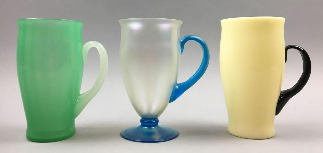Collection of 3 : Steuben Lemonade Tumblers #7218: This beautiful collection of Steuben "Lemonade" Tumblers (Carder design #7218) measure 5-7/8 x 3-3/8 inches and include Jade Green w/Alabaster, "Verre de Soie" w/ Celeste Blue, and Ivrene w/ Black. Al