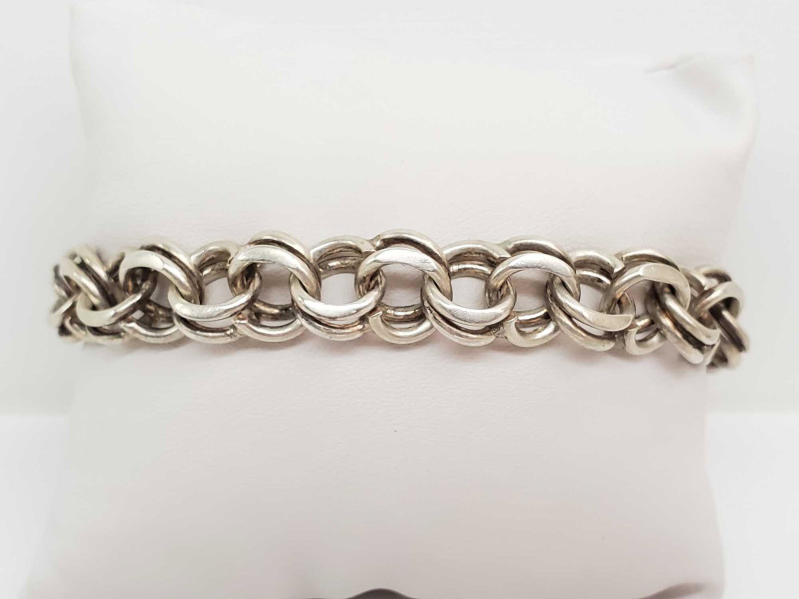 Sterling Silver Parallel Curb Chain Bracelet: 9 inch Sterling Silver Parallel Curb Chain Bracelet secures with a c-ring. 38.6g