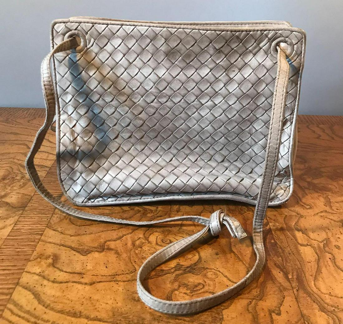 Vintage Bottega Veneta shoulder bag: 9.5x4x7.5 inches. Tan woven leather exterior. Tan and brown leather and satin lining. Brass hardware. Includes BV pocket mirror. Good used condition.