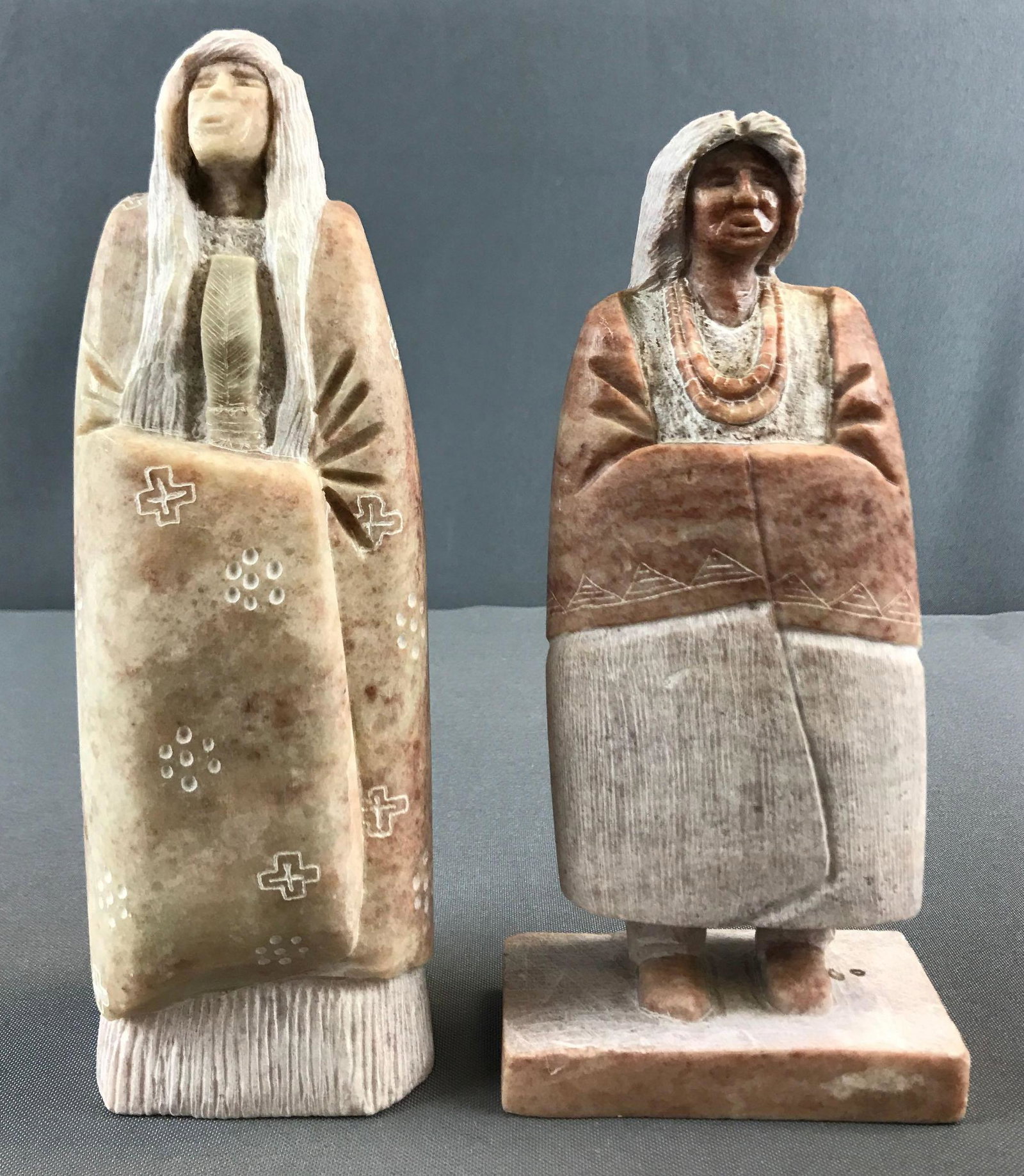 Group of 2 Native American Alabaster Statues: Carved alabaster, one marked BRNY, the other Tahnilwod. Tallest is 8.25.