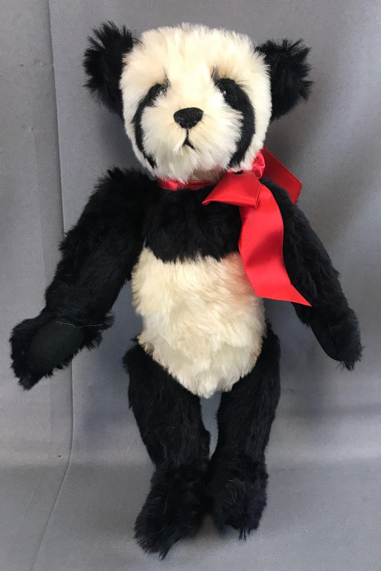 1991 Janet Reeves Hug-A-Bear panda: Ying Ying is a 13 inch mohair bear with glass eyes. Articulated head, shoulders and hips. Tag signed by artist.