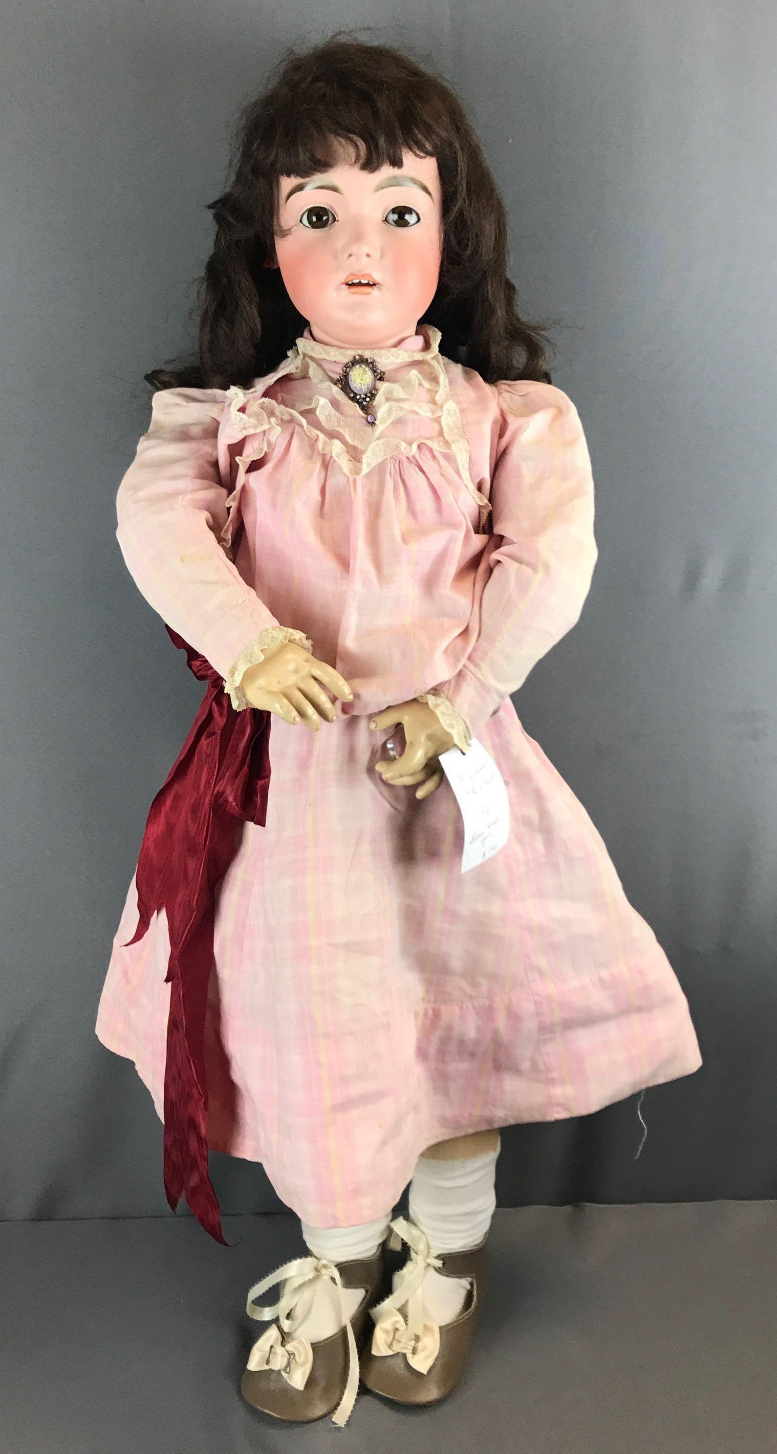 Antique Kammer and Reinhardt Doll: 38 inches tall, brown sleep eyes. Jointed limbs. Hair is not attached.