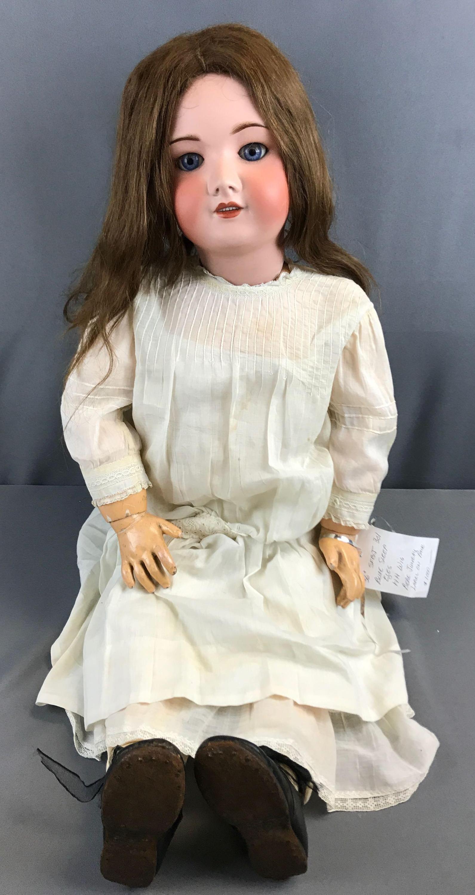 Antique SFBJ Bisque head doll with brown hair and blue (1 of 8)