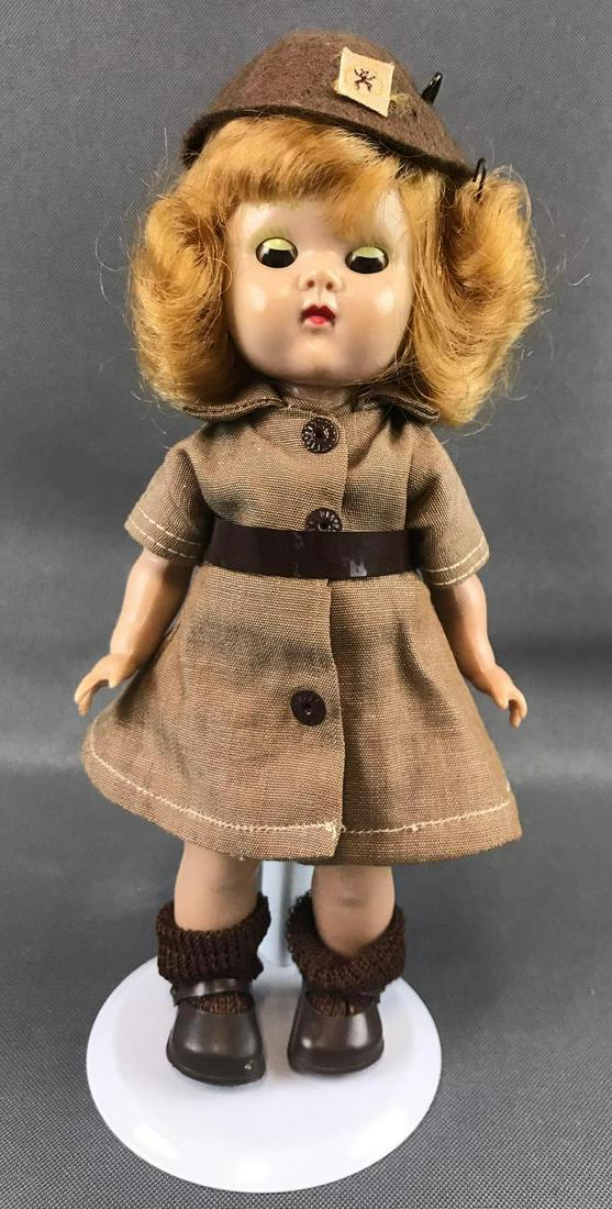 Vintage 1954 Vogue doll: 7.5 inches. Ginny, Straight-leg walker, sleepy eyes, painted lashes. Dress and belt handmade. Shoes, socks and beanie appear authentic.