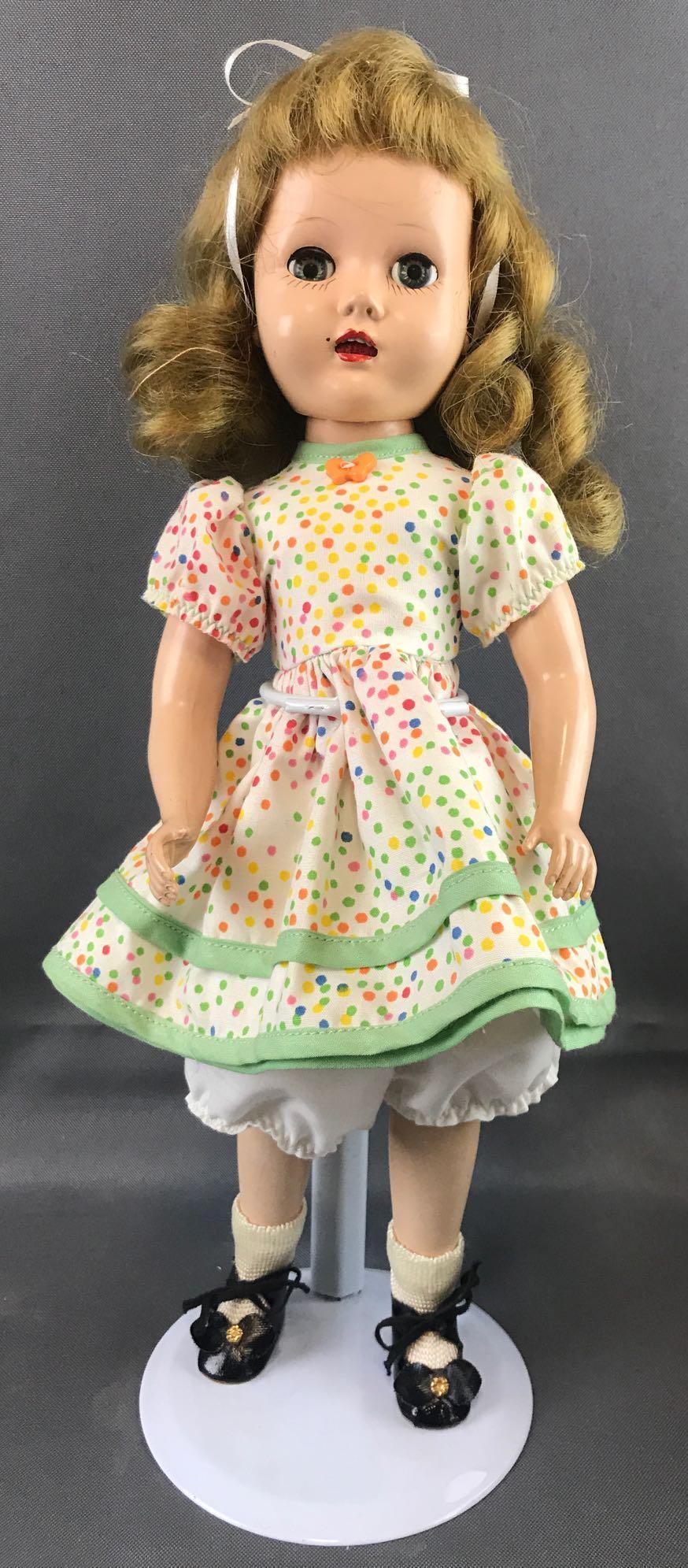 Vintage 1950s doll: 13 inches. Hard plastic, made in USA. Sleepy eyes. Head detached