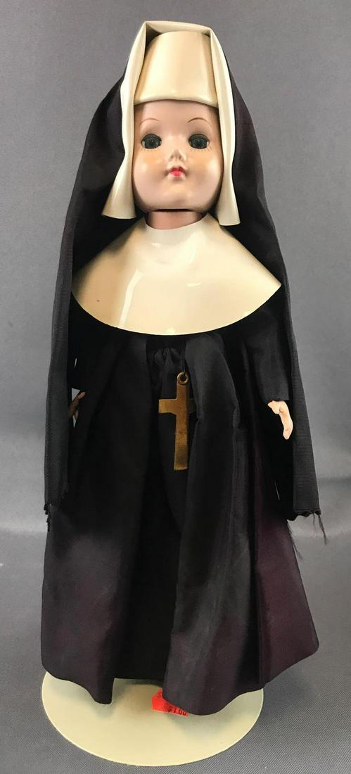 Vintage 1950s doll: 12 inches. Hard plastic. Very loose head and arms. Unmarked