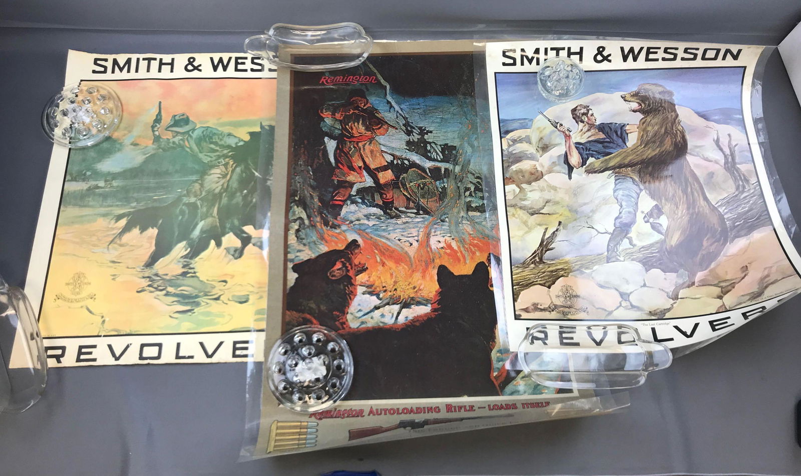 Group of 3 Vintage Gun Advertising Posters: Remington 19x28.5, smith and Wesson Revolvers. 2 are in plastic. Posters only.