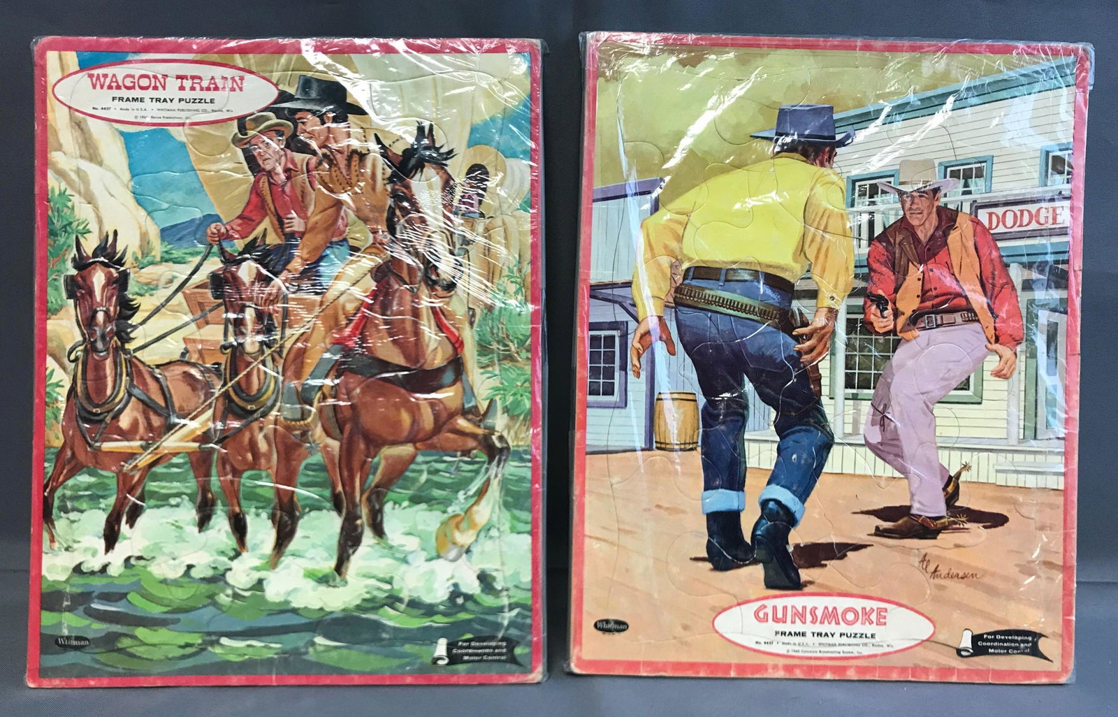 Group of 2 Vintage Frame Tray Puzzles: By Whitman, 1960-61. 11.5x14.5. Gun smoke and wagon train