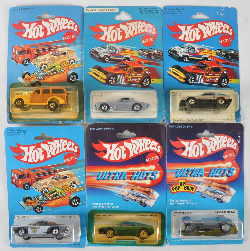 Group of 6 Hot Wheels Die-Cast Vehicles in Original: Includes Jet Sweep X5, Wind Splitter, Sheriff Patrol, Omni 024, Stutz Blackhawk, and 40's Woodie. New in Original Packaging