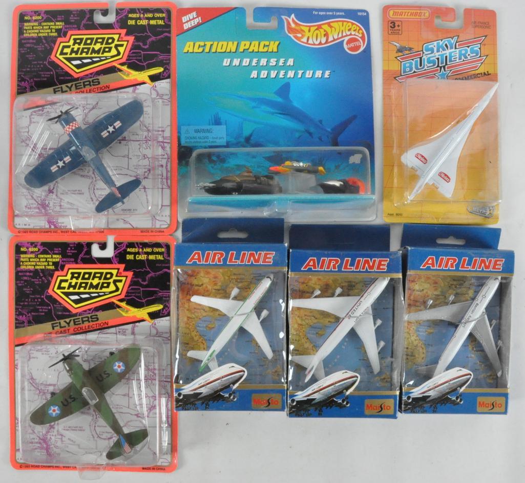 Group of 7 Die-Cast Airplanes in Original Packaging: Includes Road Champs, Matchbox Sky Busters, Hot Wheels, and Maisto.