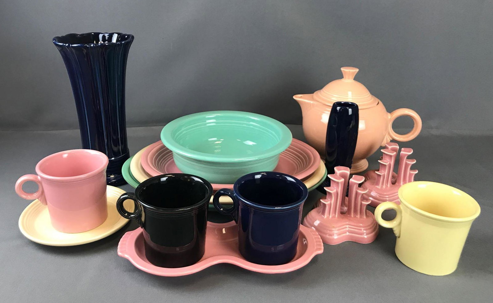 Group of 15 pieces Fiesta Ware: Large green platter-13.25 inches, Large dark blue vase-9.5 inches