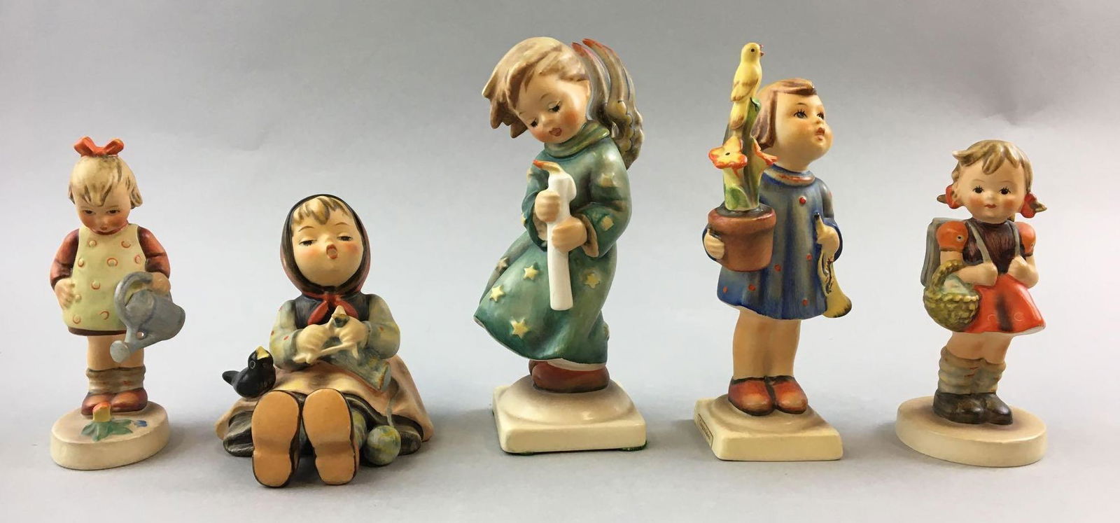Group of 5 Vintage Goebel Hummels: Includes little gardener, happy pastime, congratulations and more, W. Germany, largest is 6 inches tall