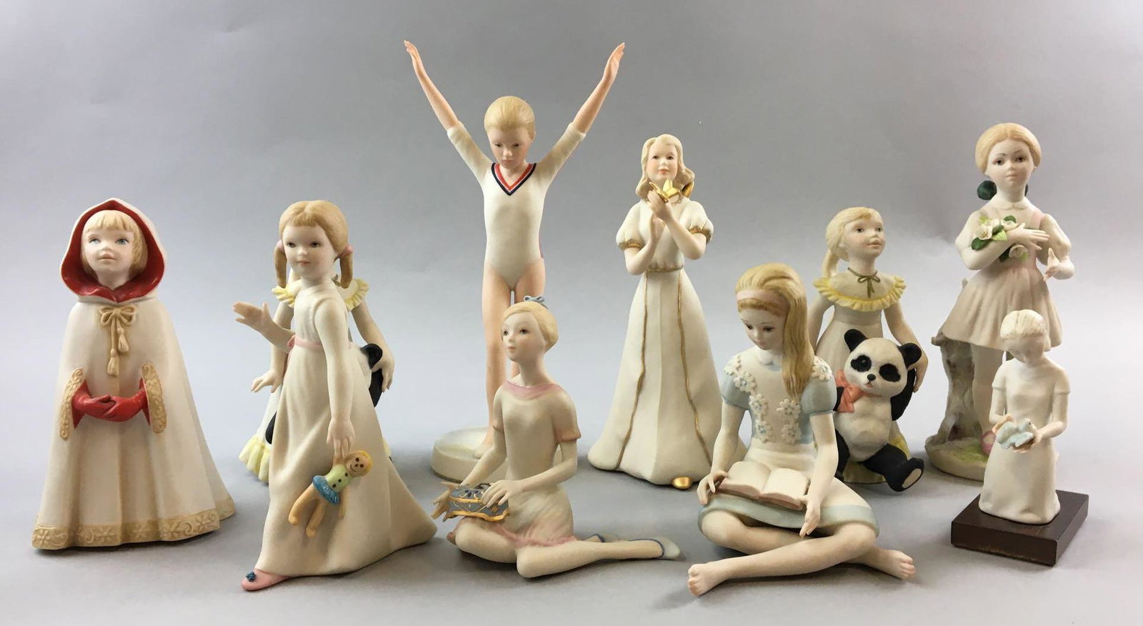 Group of 10 Cybis Porcelain Figurines: The Olympic girl has some damage to her fingers, Largest is 10 inches tall