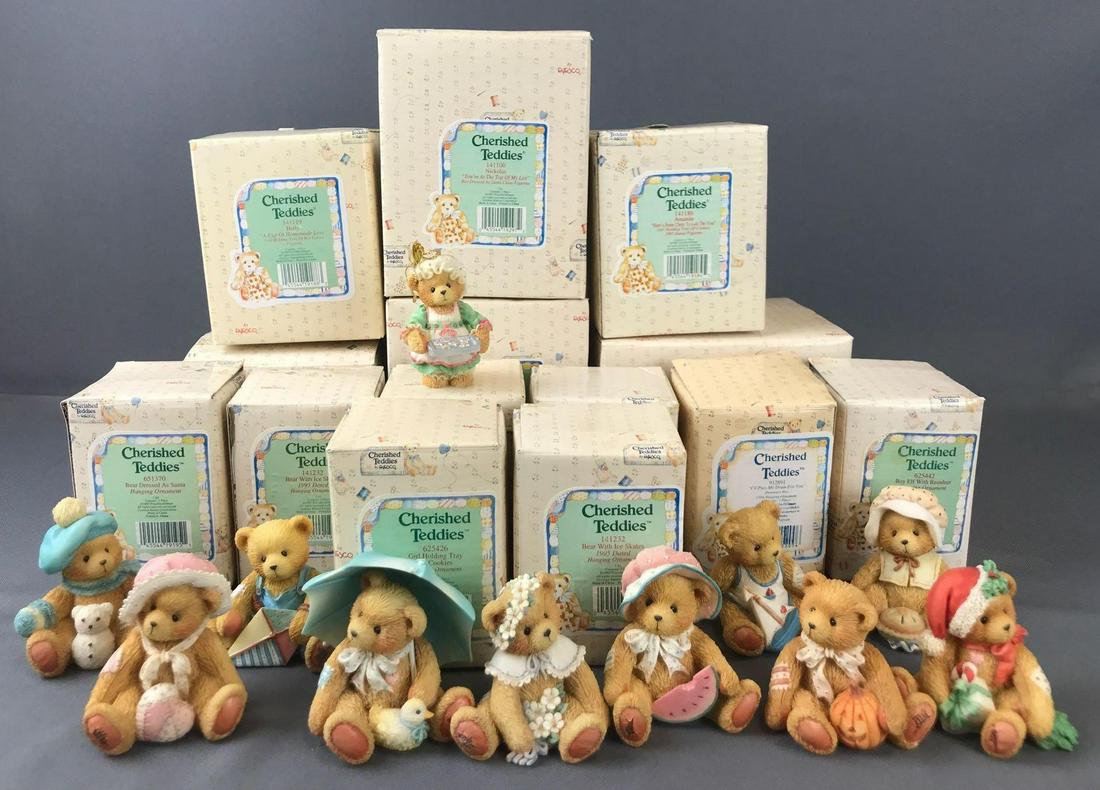 Group of 24 Cherished Teddies figurines and ornaments: 14 boxed Christmas ornaments and figurines. 10 Months of the Year figurines- missing June and September. Broken umbrella on April figurine