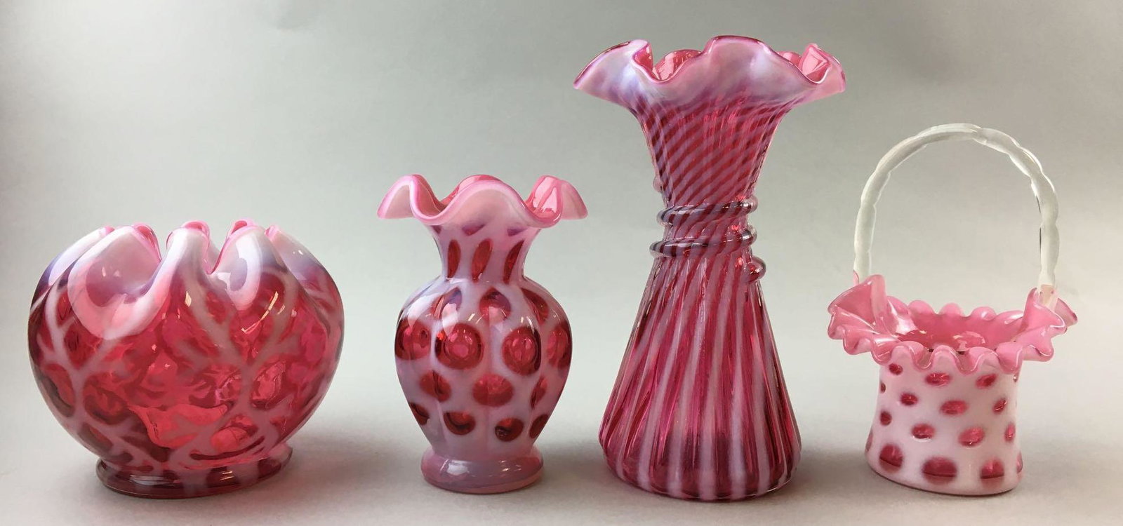 Group of 4 Cranberry Milk Overlay Fenton Glass: Largest is 7 1/2 inches tall