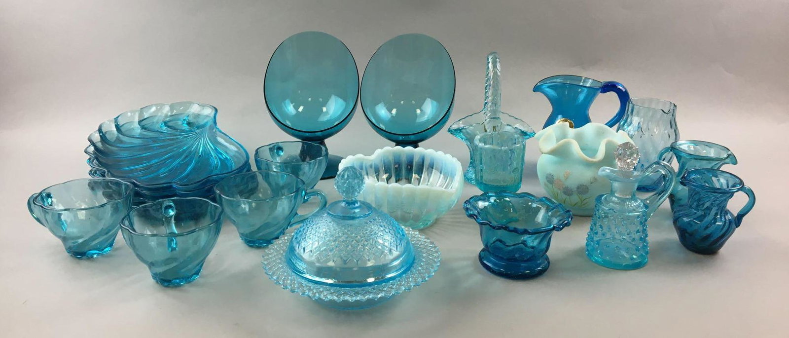 Large Group Of Vintage Miscellaneous Blue Glass: Includes Shelton glass works pitcher, westmoreland glass basket, covered dish and more, largest is candlestick holders 7 inches tall