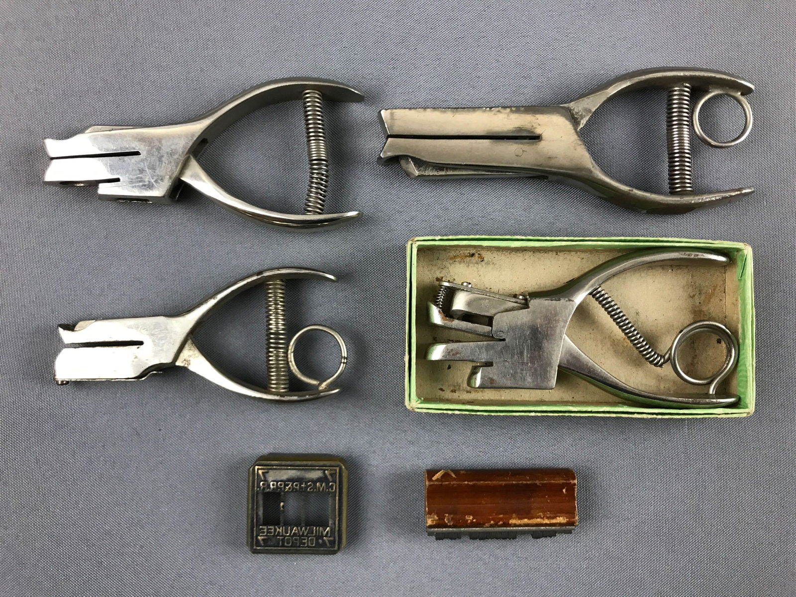 Group of Vintage railroad conductor ticket punch: 4 ticket punches in various sizes, each has different punch shape. Plus 2 stamp items