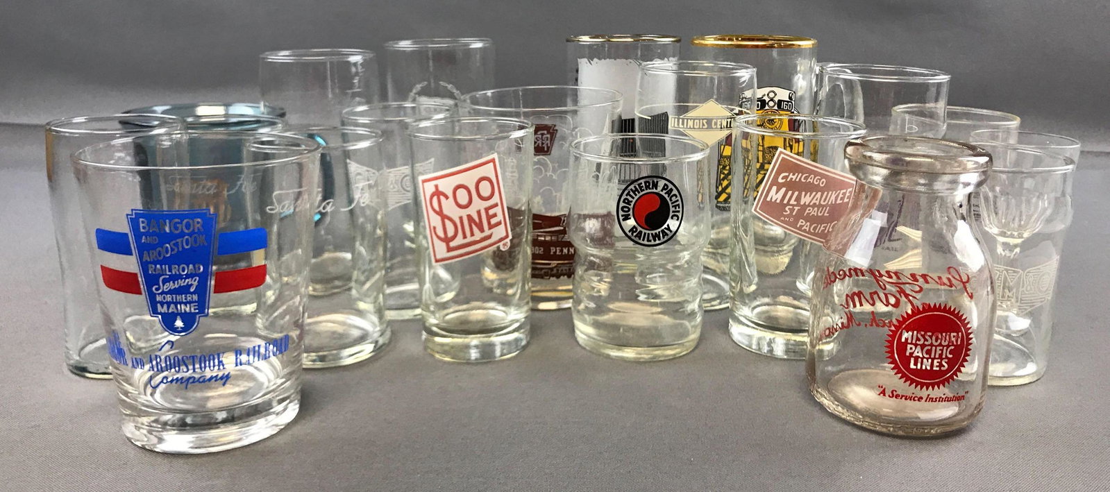 Group of 20 vintage glassware from railroad lines: Includes union pacific, Santa Fe, Missouri pacific lines, and more. Tallest is 5 1/2 inches