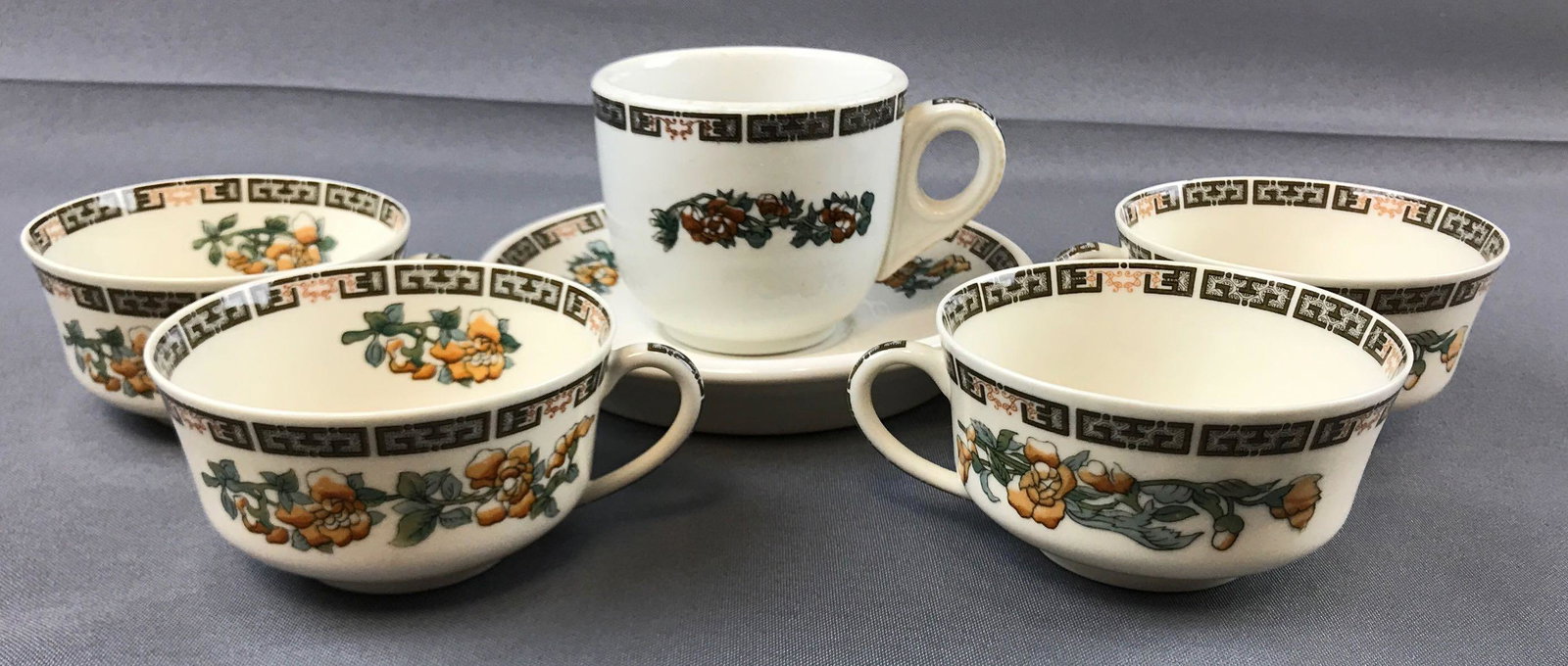 Group of 6 vintage Indian Tree China pieces: 5 cups, one saucer. Saucer is 6 inch diameter. Syracuse China. This was a pattern used on the Pullman railroad line, but these pieces are unmarked.