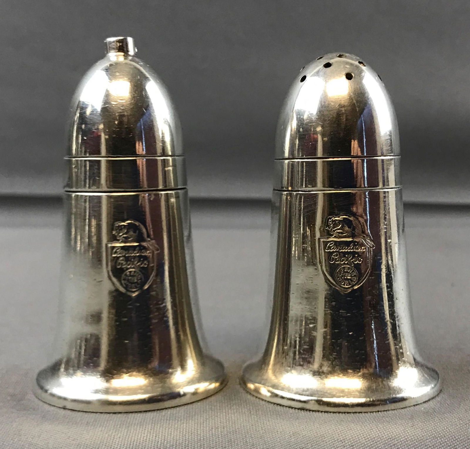 Vintage Canadian Pacific Railroad salt and pepper: Mappin and Webb silver plate shakers. 3.5 inches tall. Some wear from use.
