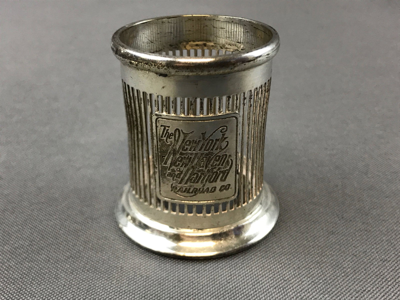 Vintage silver plate railroad serving piece: New York New Haven and Hartford railroad co. 2 inches tall, made by Bernard Rice Sons Inc. Some wear from use.