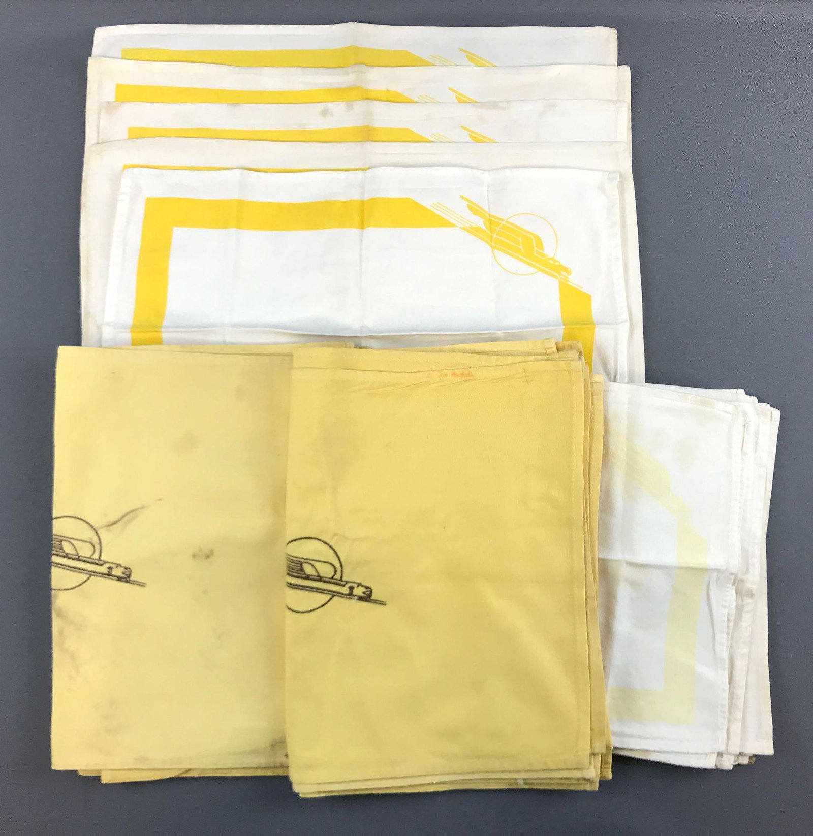 Group of vintage UP Streamliner linens: Napkins/placemats. Some wear and stains. Yellow ones are 17x12 inches