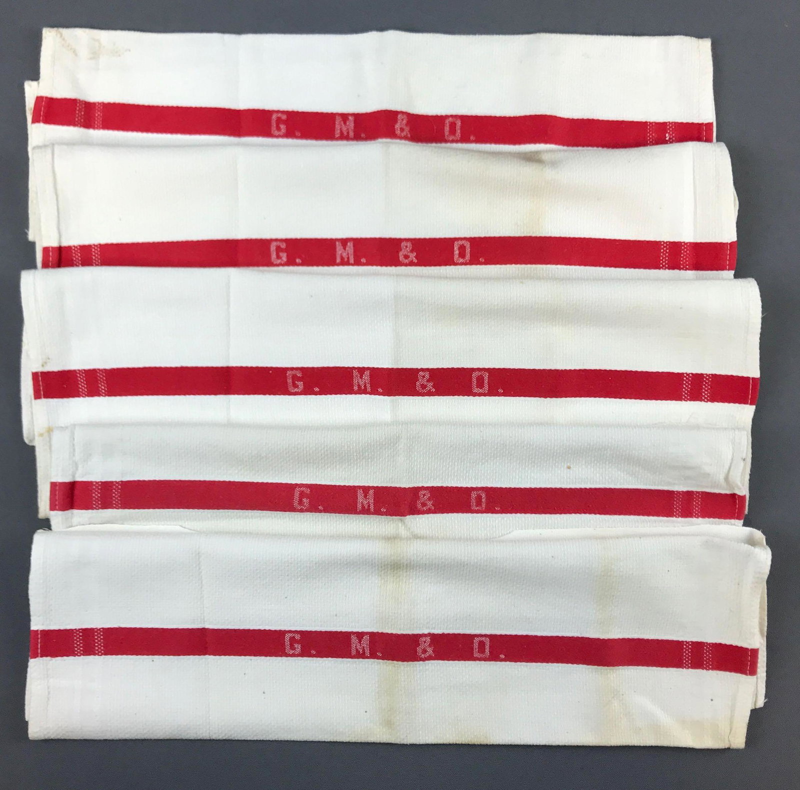 Group of 5 Vintage GM and O railroad hand towels: Gulf Mobile and Ohio railroad towels. Some wear and stains. 17x14.5 inches.