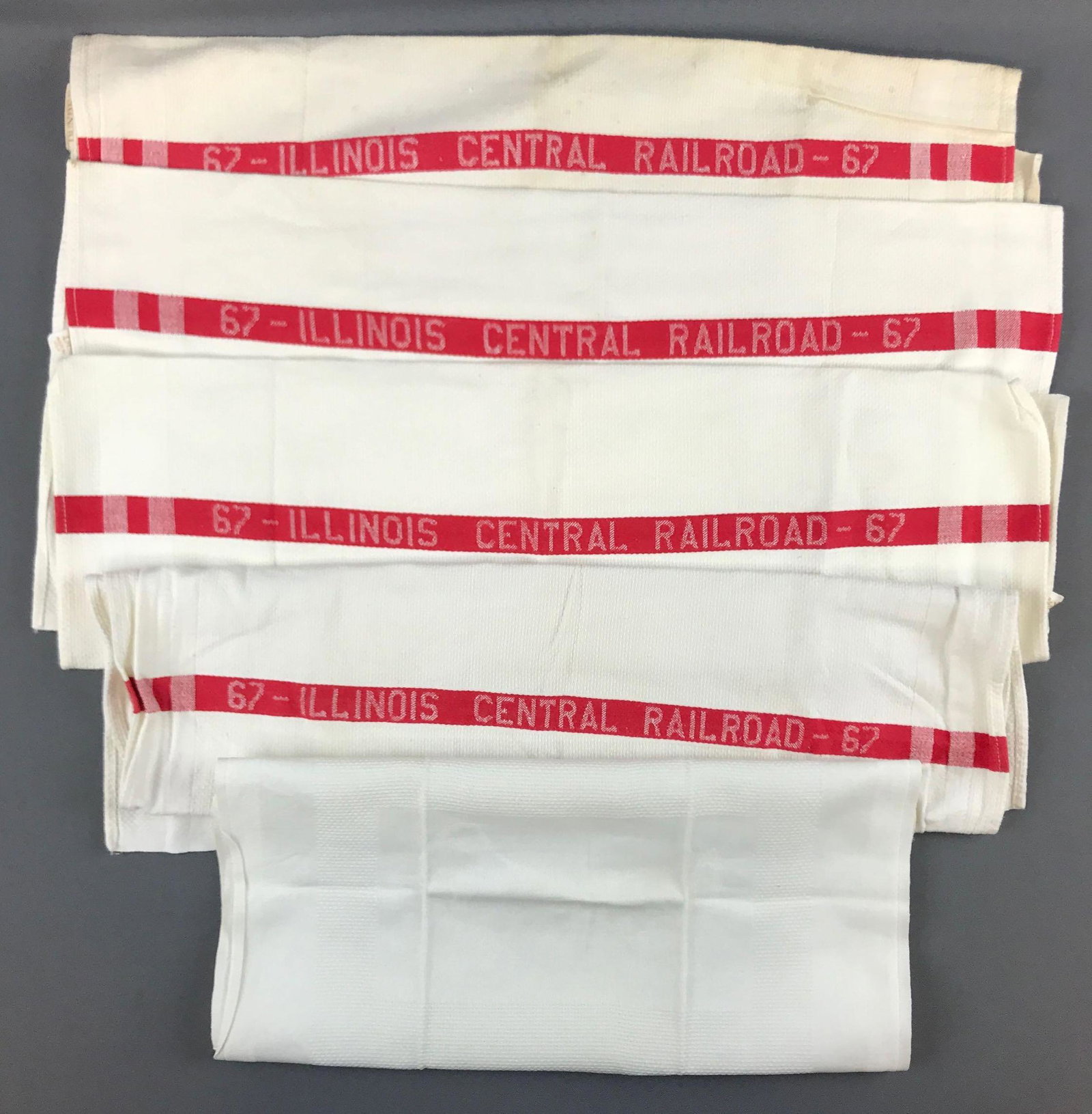 Group of 5 vintage IL Central Railroad linens: 4 hand towels, one napkin. Napkin is 15x21