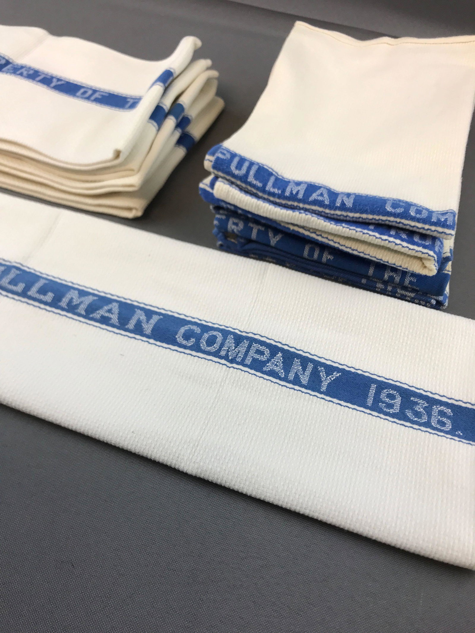 Group of 11 vintage Pullman Company hand towels: One dated 1936. 22x16 inches. Some wear and stains
