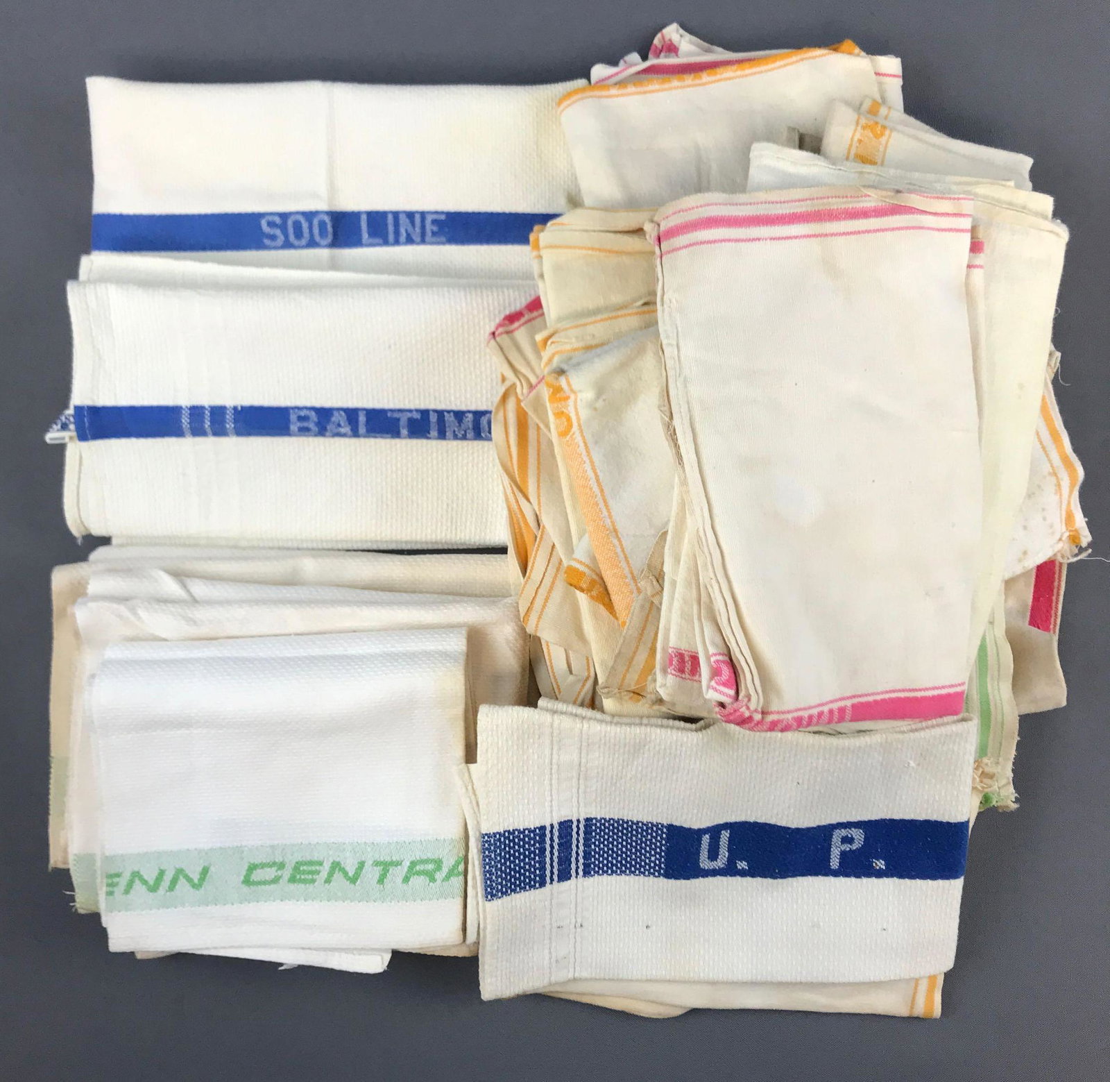 Group of vintage railroad hand towels: UP, Soo line, Penn Central, B&O. Stains and wear.