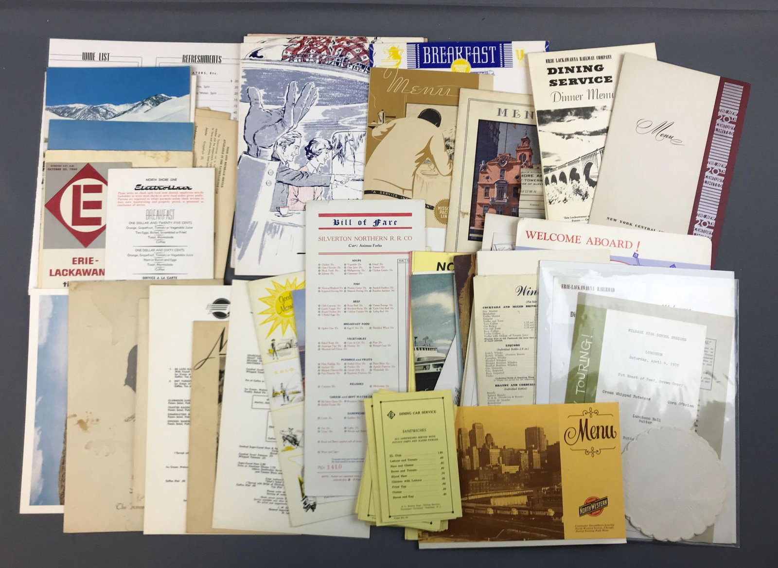 Group of vintage railroad dining car menus: Missouri pacific, New York Central, Erie Lackawanna, and more