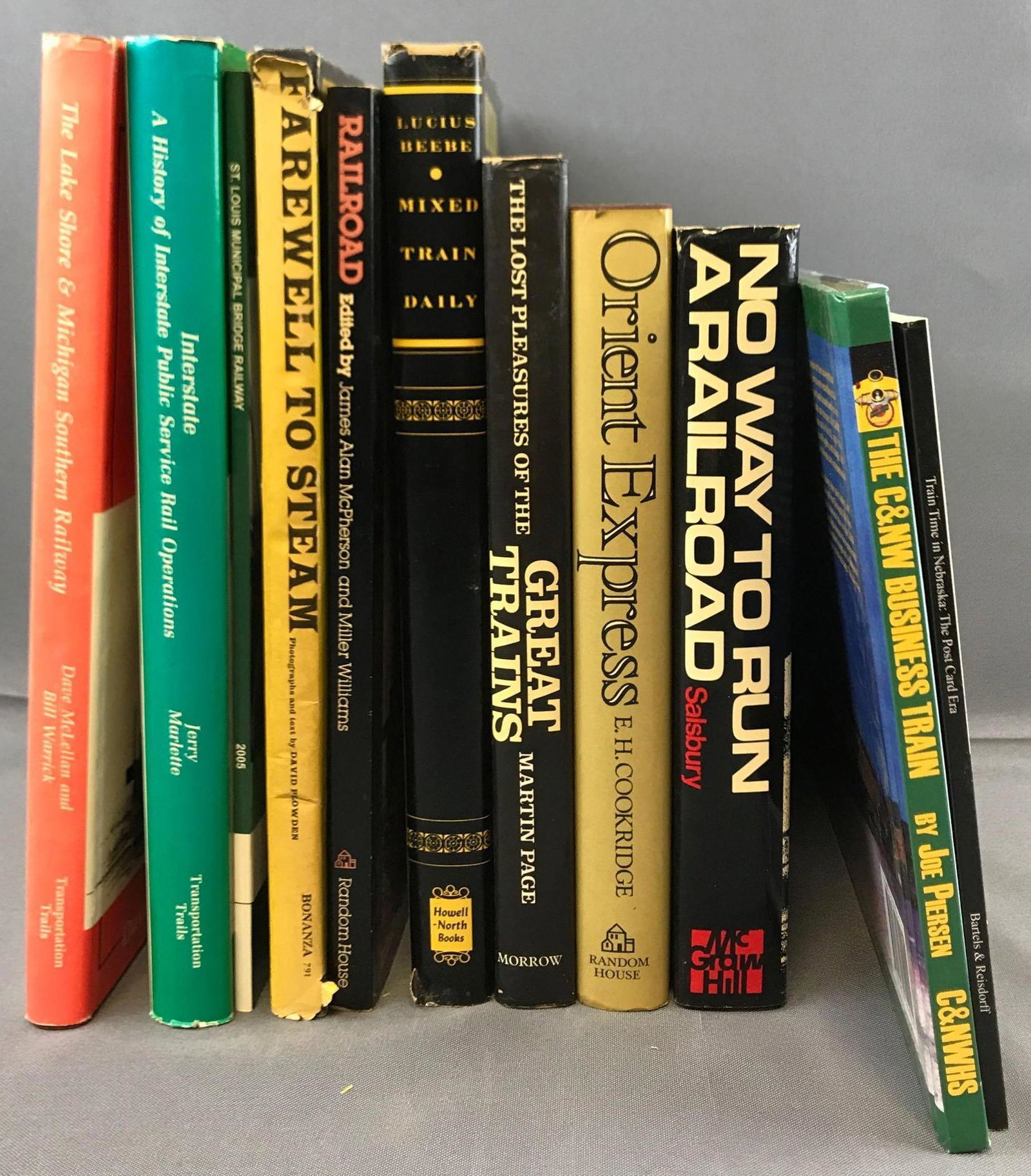 Group of 11 railroad books: Orient express, mixed train daily, farewell to steam, and more