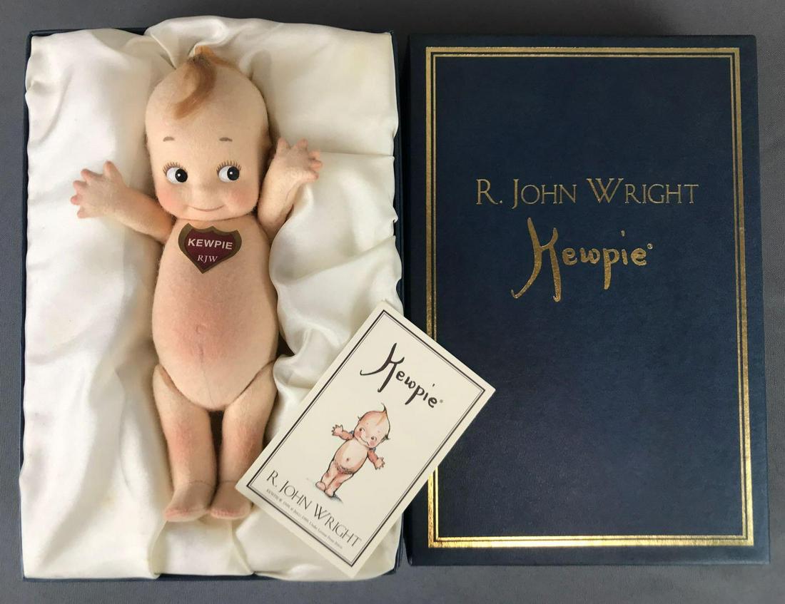 R. John Wright Kewpie in original box: 8 inches, molded felt, jointed arms and legs.