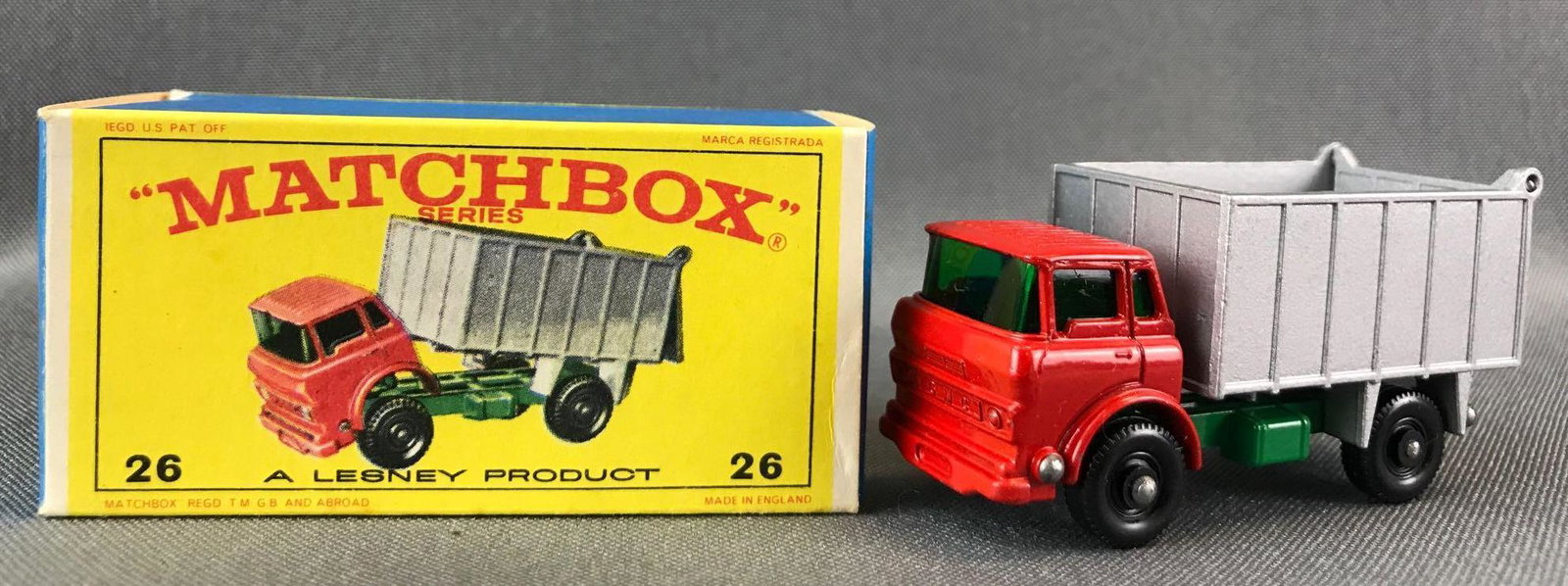 Matchbox No. 26 G.M.C. Tipper Truck Die-Cast Vehicle: Red and silver body, green base, green windows, BPW. A Lesney Product. Made in England