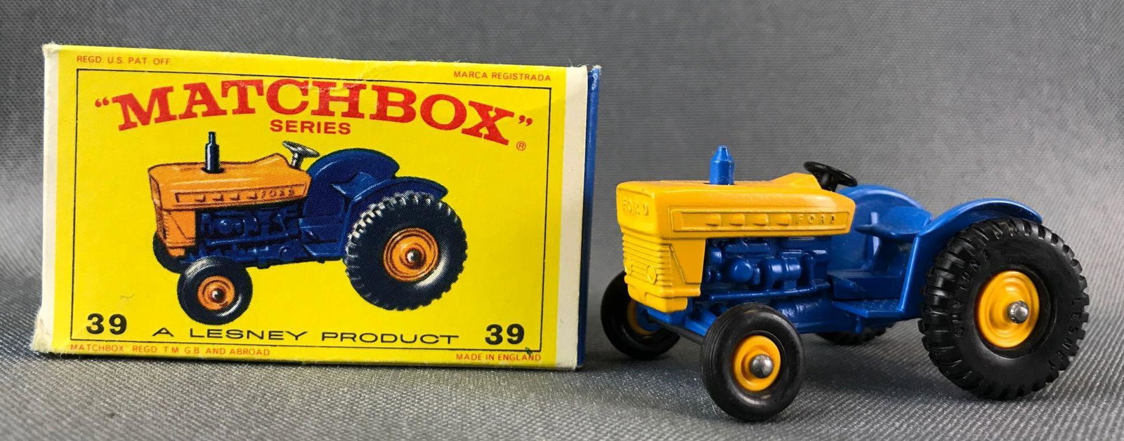 Matchbox No. 39 Ford Tractor Die-Cast Vehicle with: Blue/yellow body, BPW. A Lesney Product. Made in England