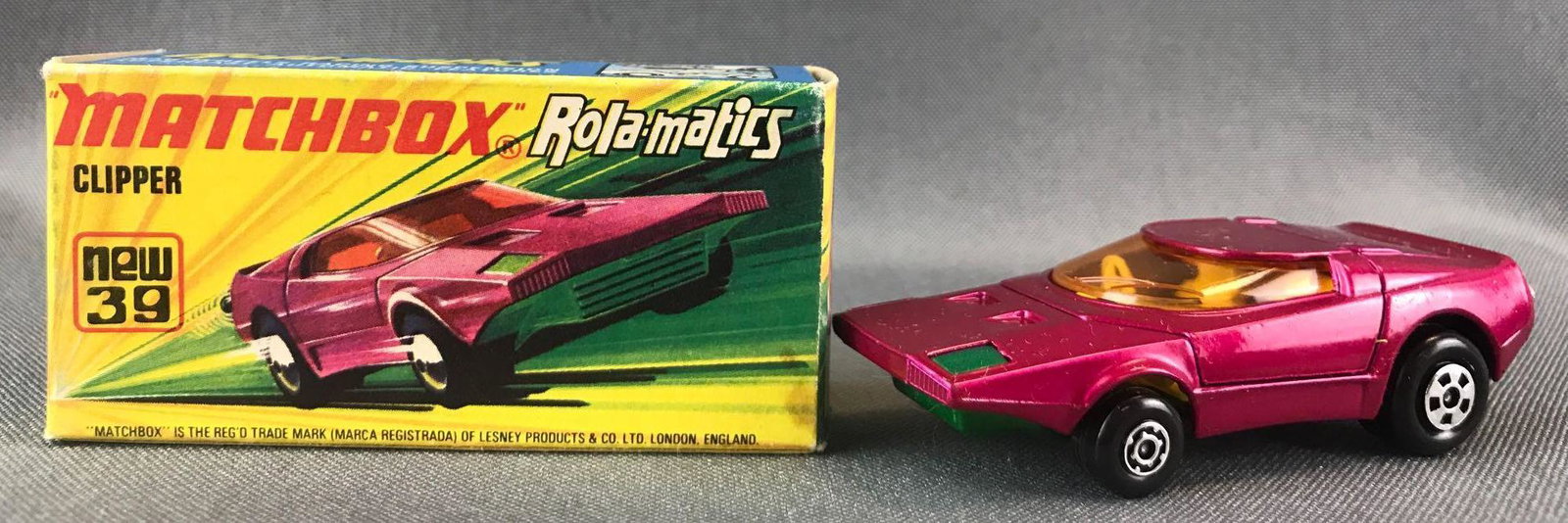Matchbox Rola-matics No. 39 Clipper Die-Cast Vehicle: Fuschia body, green base, amber windows, BPW. A Lesney Product. Made in England