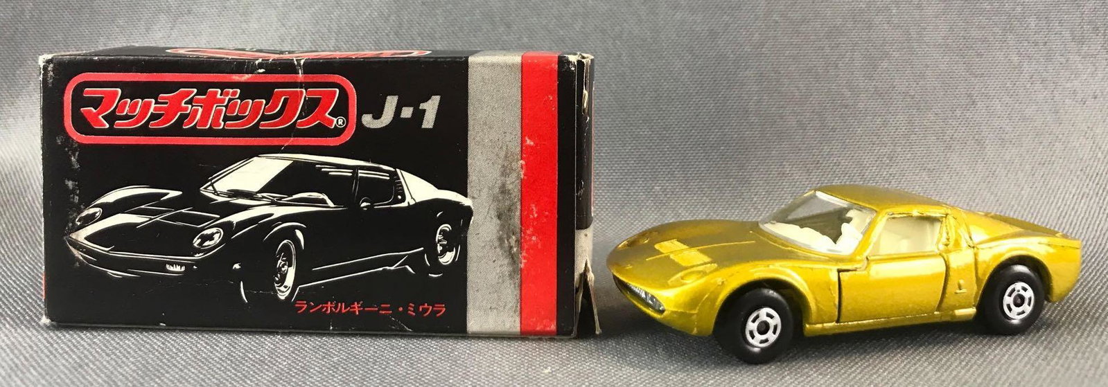 Japanese Market Matchbox No. J-1 Lamborghini Miura: Gold Body, BPW. Some box damage. A Lesney Product. Made in England