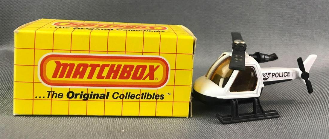 Matchbox No. 75 Helicopter Die-Cast Vehicle with: White body, amber windows, 36 and Police decals. A Lesney Product. Made in England
