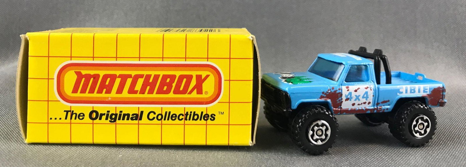 Matchbox No. 57 Mountain Man Die-Cast Vehicle with: Blue body, blue windows, BPW. Conor, Mountain Man, 4x4 decals. A Lesney Product. Made in Hong Kong