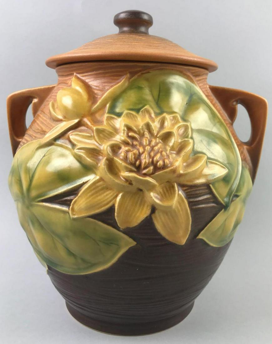 Roseville Water Lily 2 Handle Cookie Jar with Lid: 10 inches. Small chip on flower petal