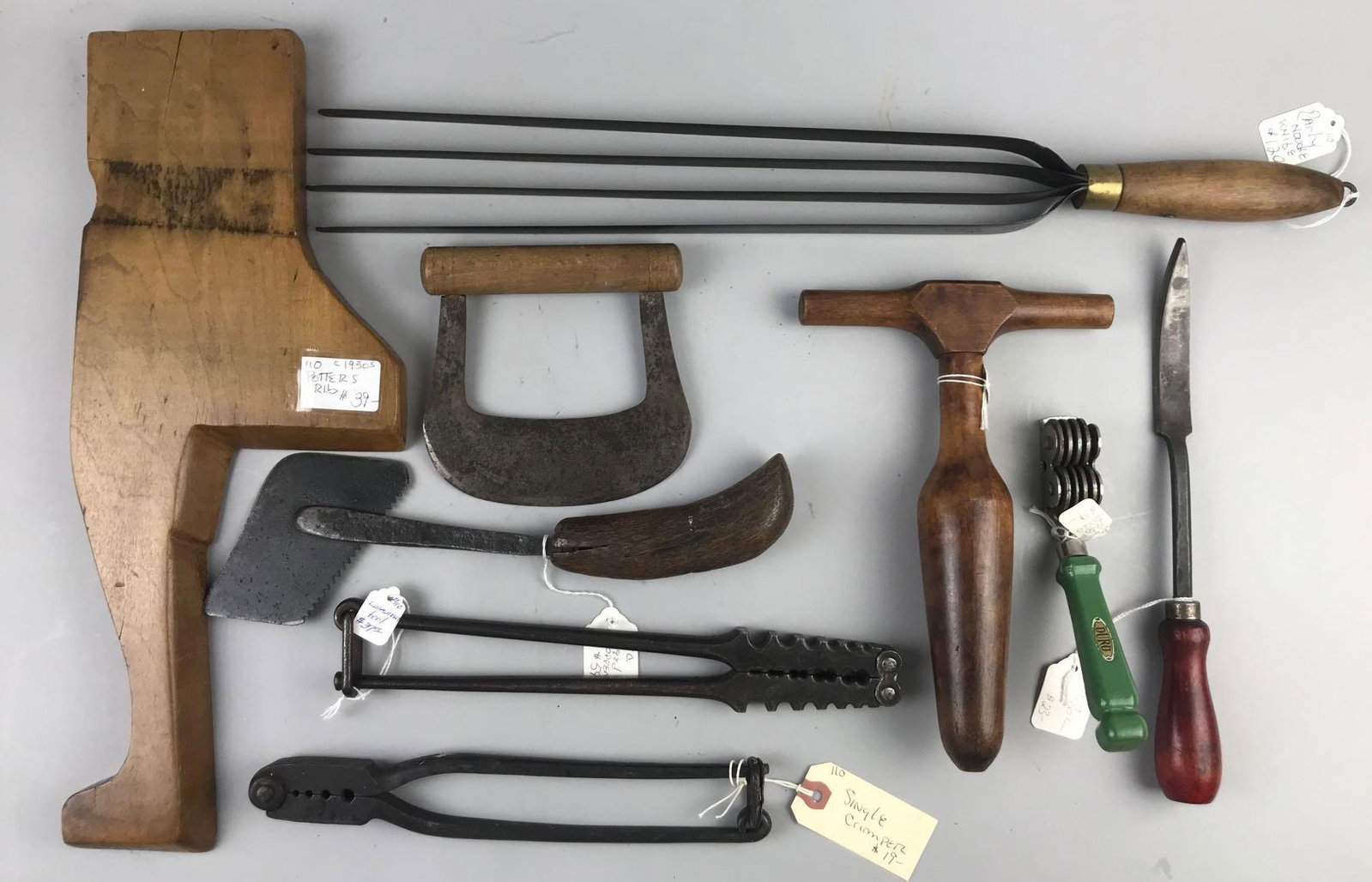 Group of 9 Vintage and Primitive hand tools: Potters rib, pasta cutter, wood tamper and more