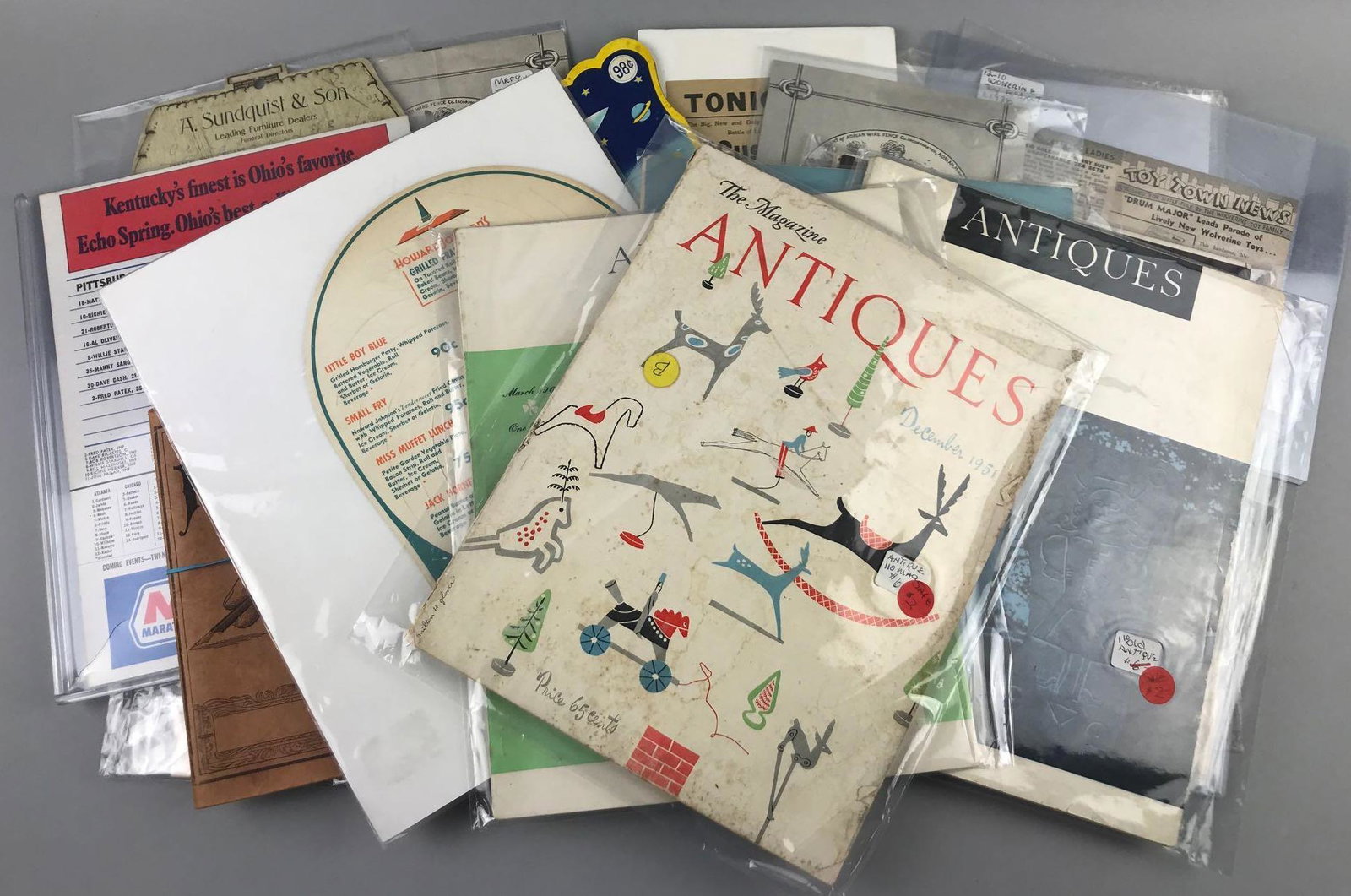 Group of 15+ pieces assorted Antique and vintage: Largest is 9.75x12 inches. Antiques magazine, labels, sewing needles, calendar and more