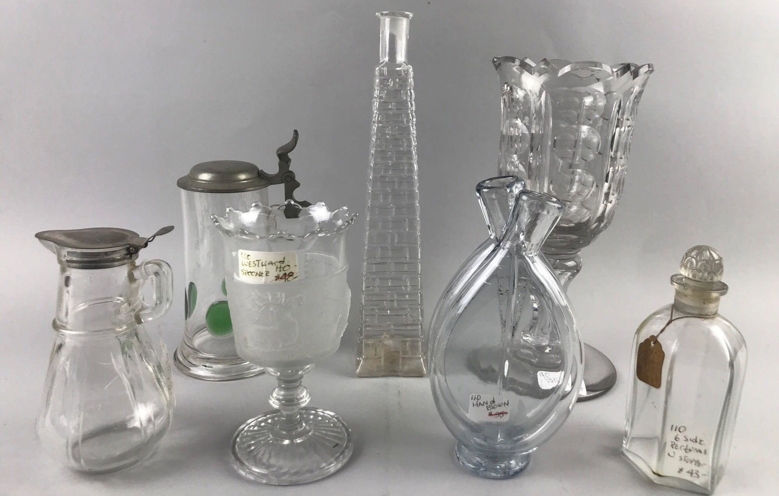 Group of 7 vintage clear glass pieces: Largest is 12 inches. Includes Hazel Atlas syrup, Gillinder & Sons Westward Ho Spooner and more