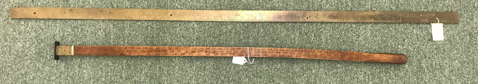 Group of 2 vintage measurers: Illinois Central Railroad brass yard stick-54.25 inches, and 2 sided wooden log rule