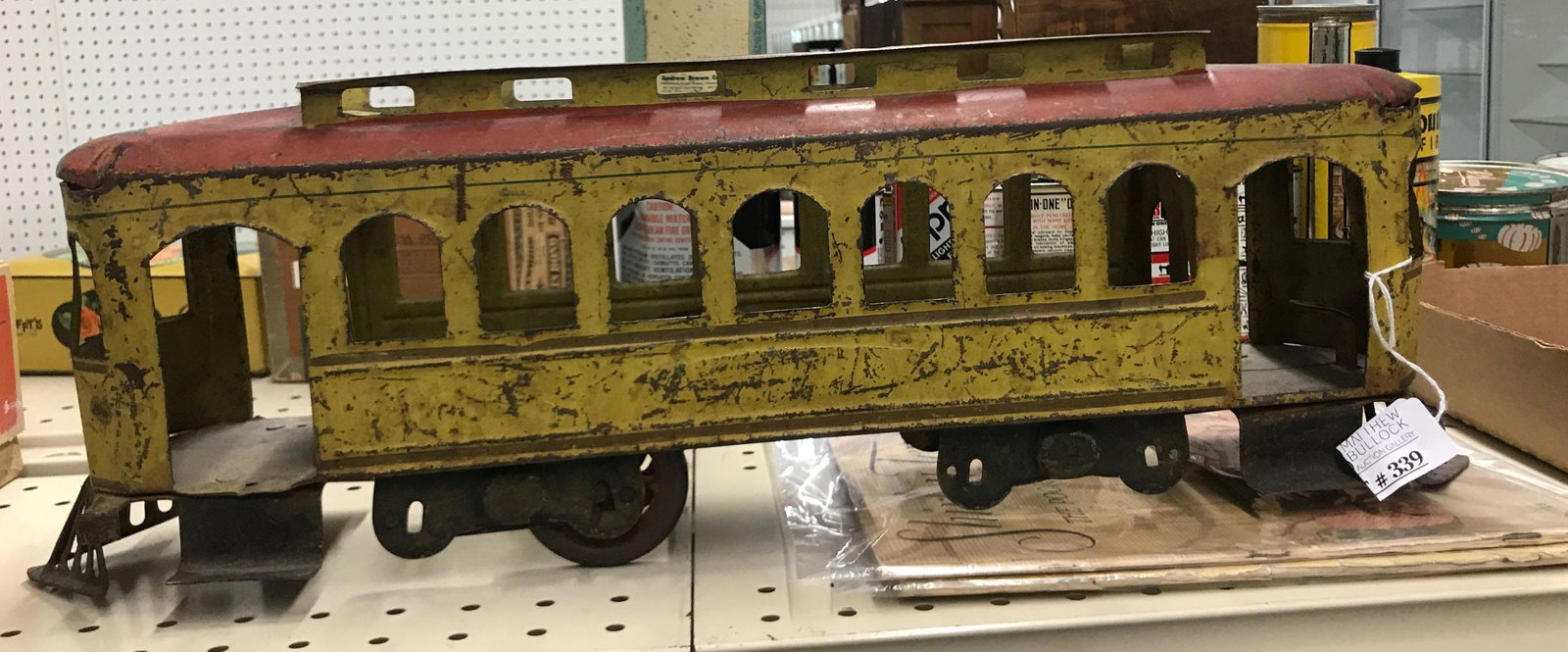 Antique pressed steel trolley train car toy: 22 inches long missing some wheels