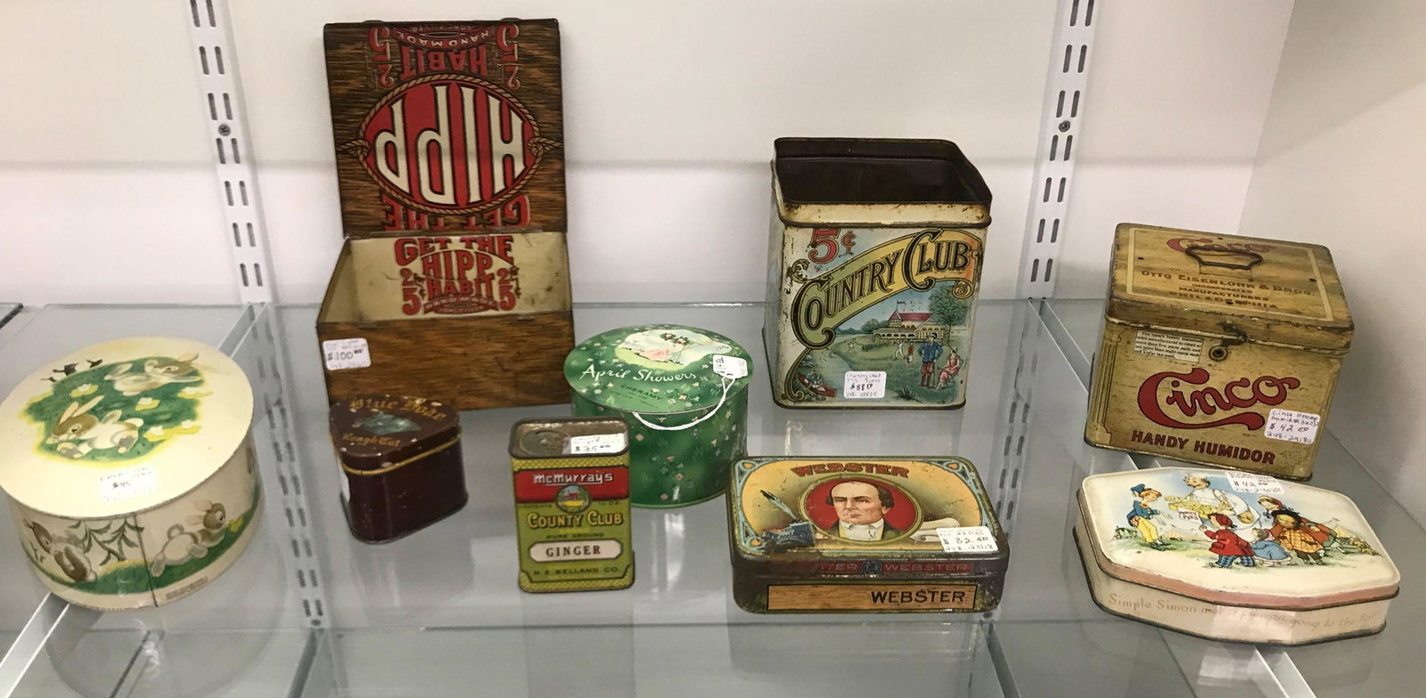 Group of 9 antique tins: Hip country club Webster Cinco blue boar penny pies